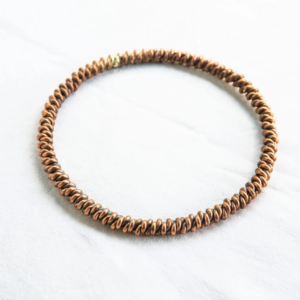 Tensory, ringi i bransoletki miedziane HANDMADE — butelka z przodu, etykieta