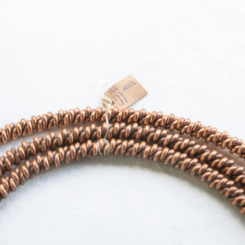 Tensory, ringi i bransoletki miedziane HANDMADE — butelka z przodu, etykieta
